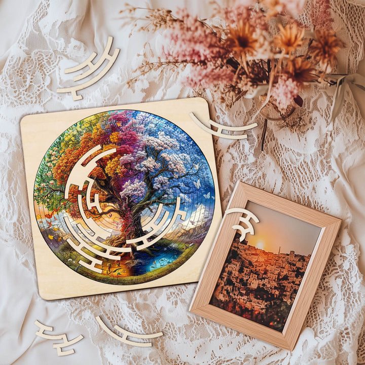 Colorful Tree of Life maze puzzle on a lace backdrop with decorative wooden pieces and a framed photo.
