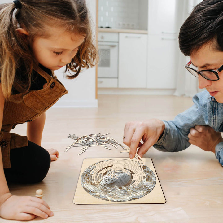 A father and daughter enjoying the Maze Puzzles¡ªElegant Owl, engaging in focused puzzle-solving playtime.