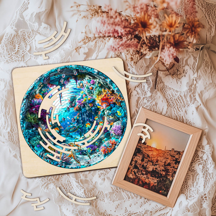 Colorful Blue Ocean maze puzzle on lace, surrounded by puzzle pieces and a framed photo, promoting focus and mental skill development.
