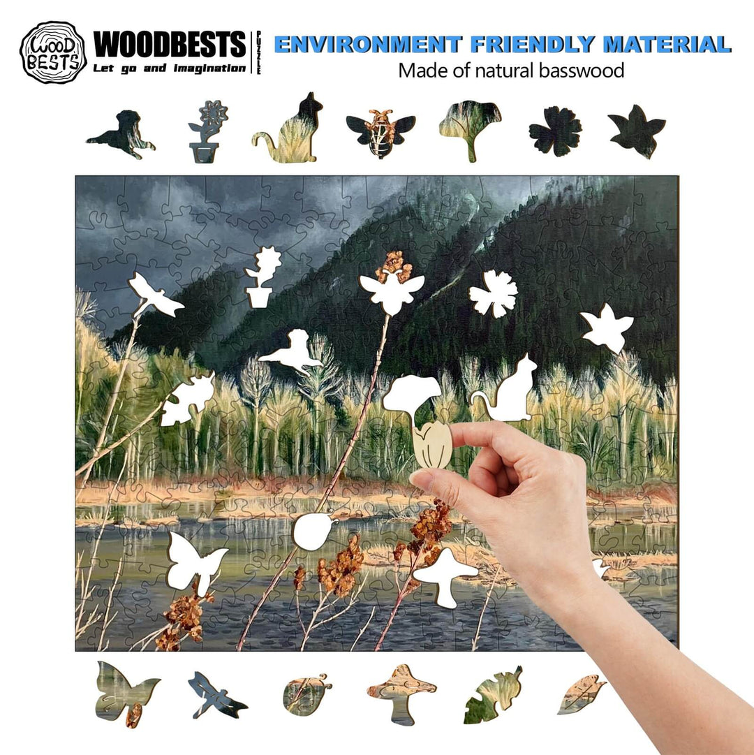 Person placing a wooden puzzle piece into a nature-themed jigsaw puzzle made of natural basswood.
