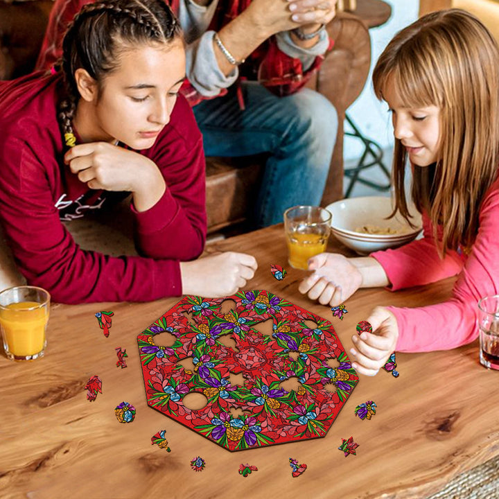 Two girls enjoying a doodle art game featuring vibrant floral patterns, surrounded by drinks and snacks.